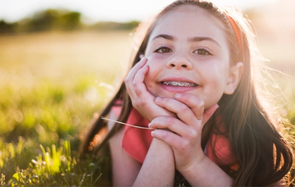 young girl smiling with straight teeth