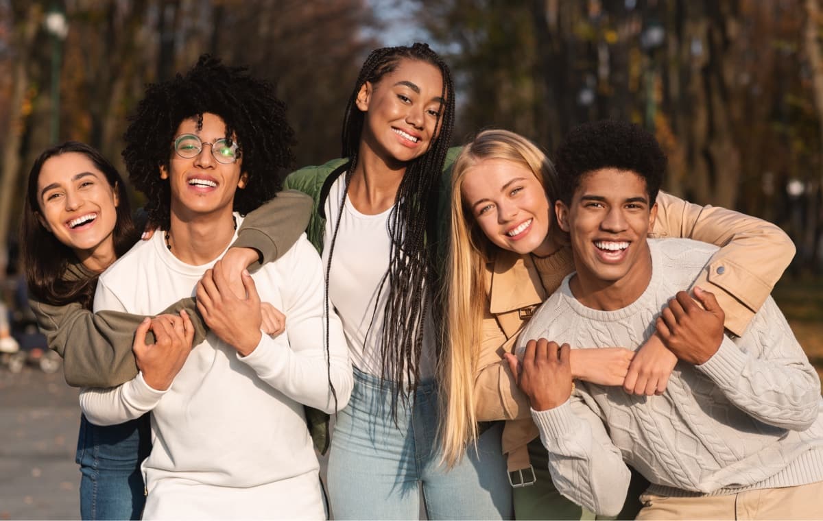 group of teenagers smiling with nice teeth